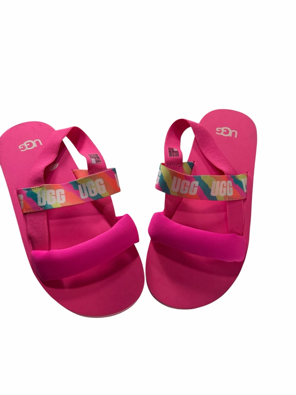 UGG Zuma Sling slides vibrant taffy pink  and a rainbow-colored elastic strap.